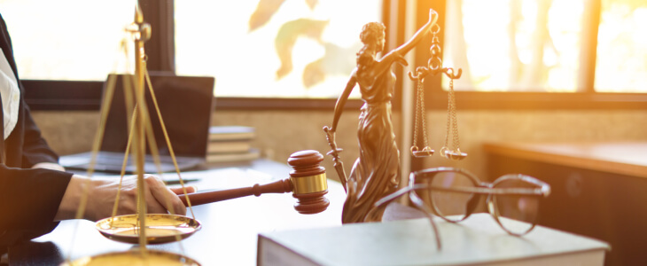 Judge's desk with scales of justice