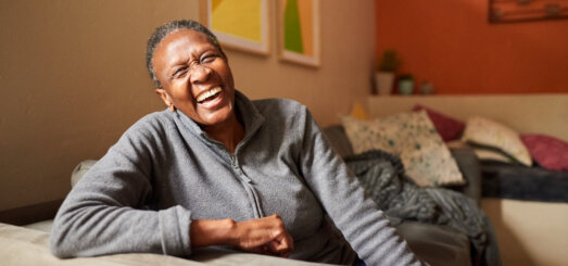 Laughing senior woman at home