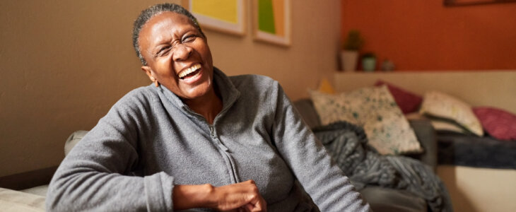 Laughing senior woman at home