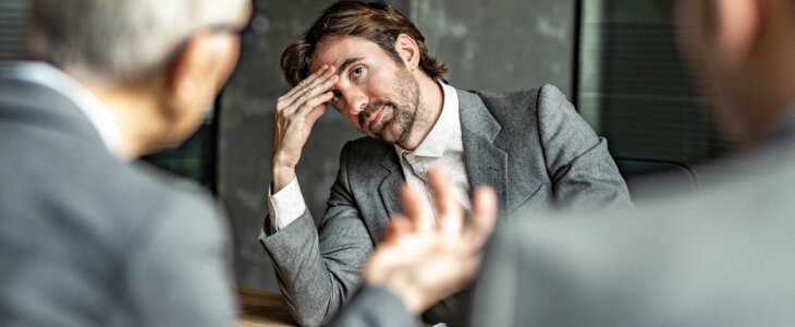 Young male entrepreneur feeling disappointment during a meeting