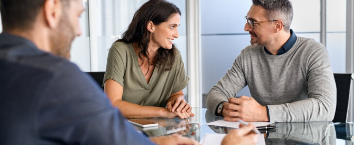 Mid adult couple consulting attorney