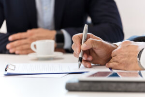 Businessman signing a contract.